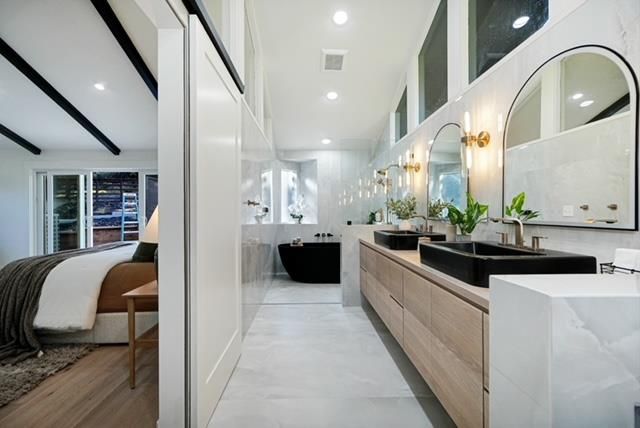 Bathroom, Dual Sink Vanities, Free Standing Baths, Interior, Pendant Lights, Recessed Lighting, Wood Texture Flooring