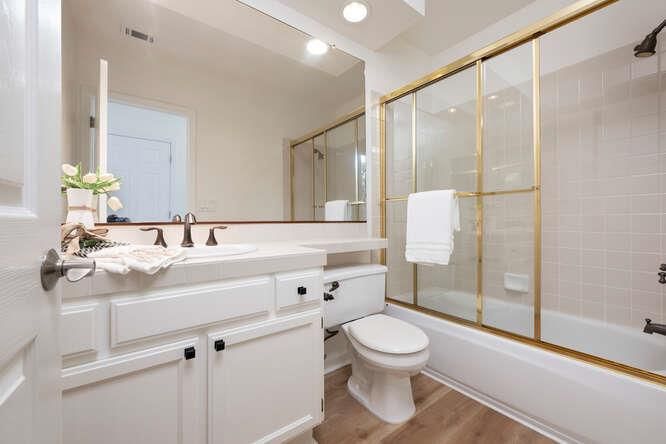 Bathroom, Glass Shower, Interior, Recessed Lighting, Tile Countertops, Wood Texture Flooring