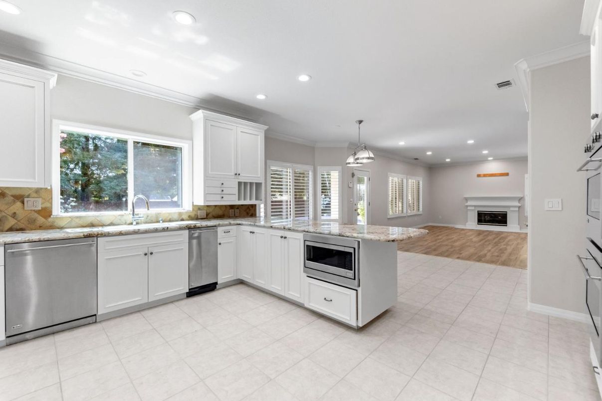 Fireplace, Interior, Kitchen, Pendant Lights, Recessed Lighting, Stainless Steel Appliances, Wood Texture Flooring