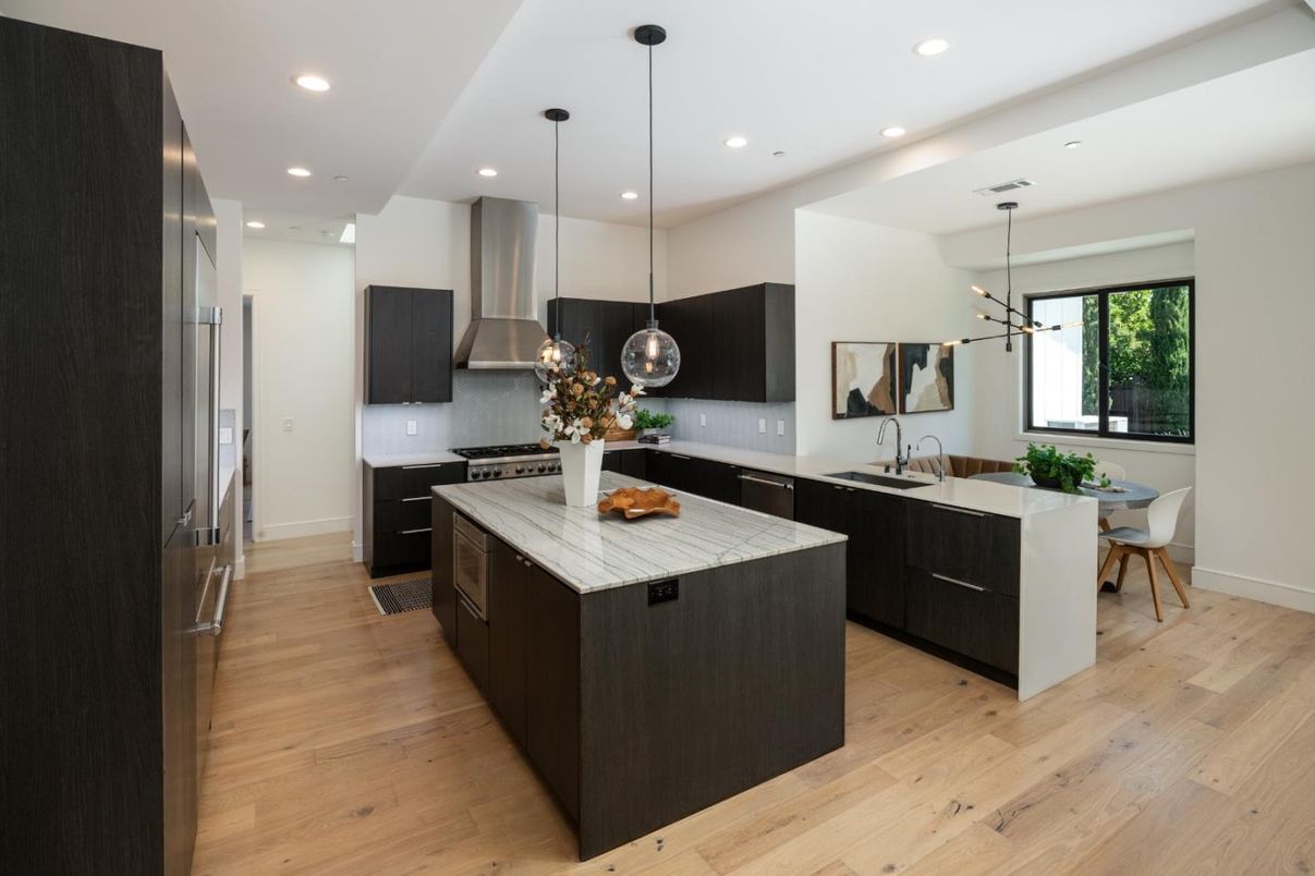 Dining room, Interior, Kitchen, Pendant Lights, Recessed Lighting, Stainless Steel Appliances, Wood Texture Flooring