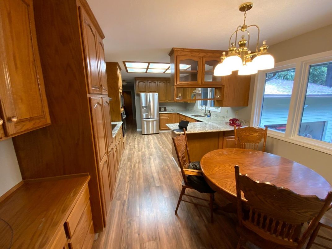 Dining room, Interior, Kitchen, Pendant Lights, Stainless Steel Appliances, Wood Texture Flooring