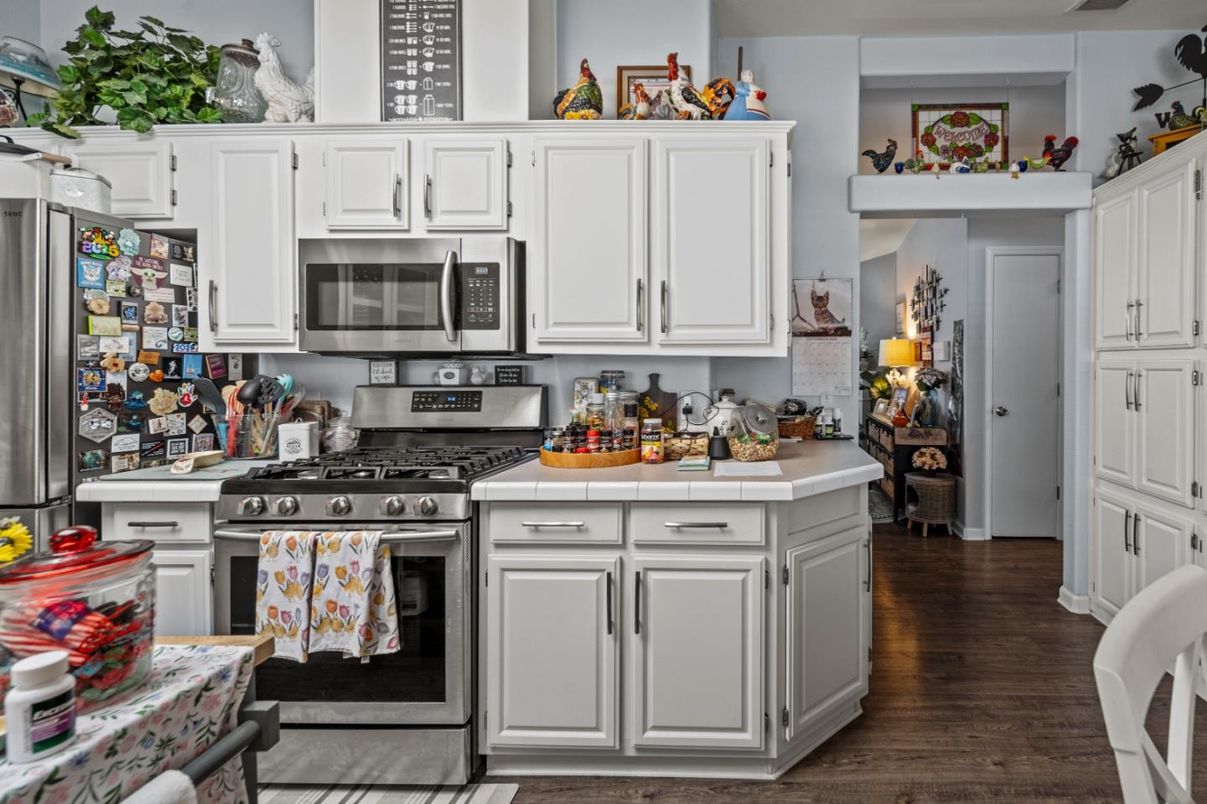 Interior, Kitchen, Stainless Steel Appliances, Tile Countertops, Wood Texture Flooring