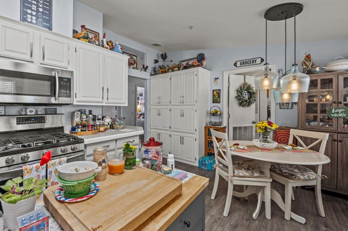 Dining room, Interior, Kitchen, Pendant Lights, Stainless Steel Appliances, Wood Texture Flooring