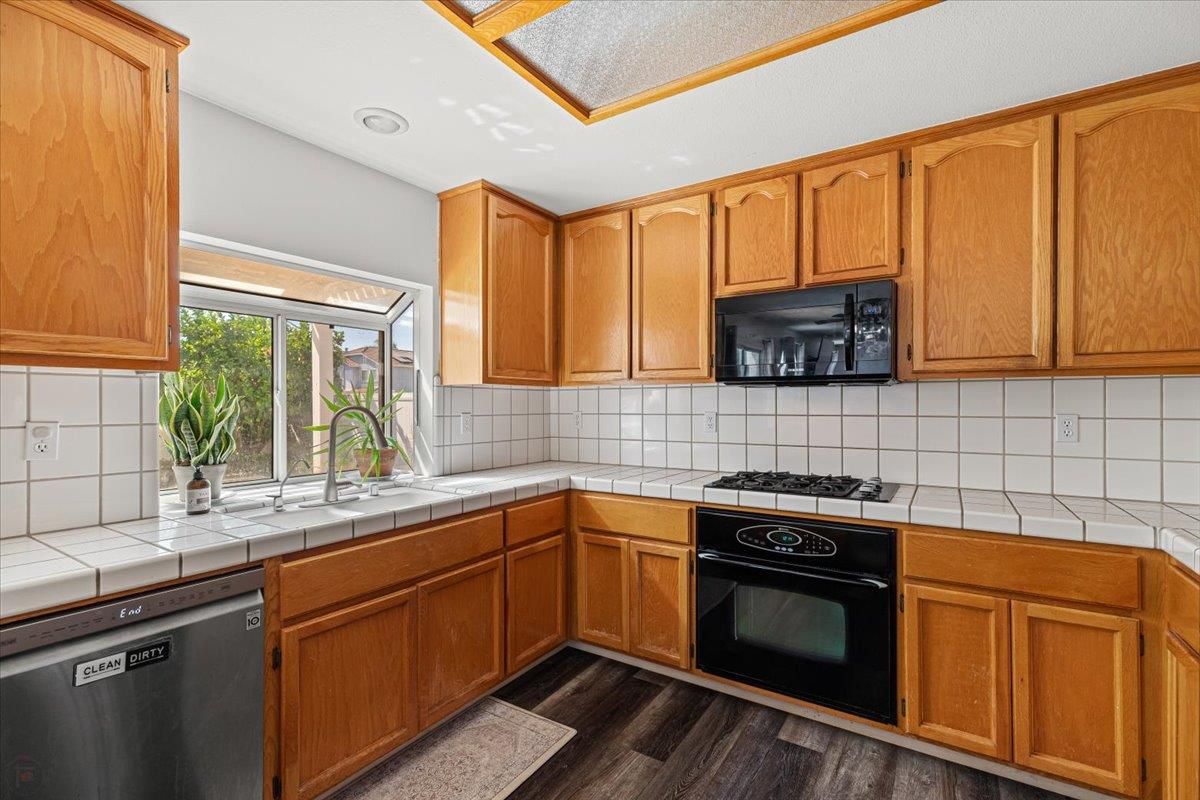 Interior, Kitchen, Recessed Lighting, Tile Countertops, Wood Texture Flooring