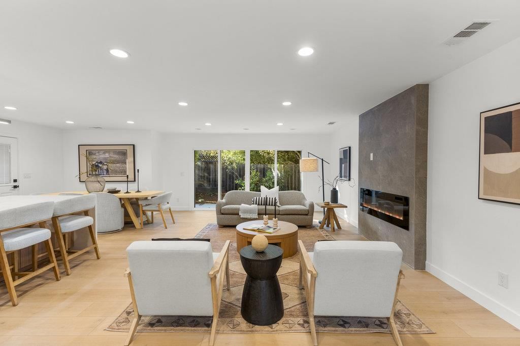 Dining room, Fireplace, Interior, Living room, Recessed Lighting, Wood Texture Flooring