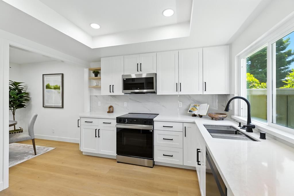 Interior, Kitchen, Marble Walls, Recessed Lighting, Stainless Steel Appliances, Wood Texture Flooring