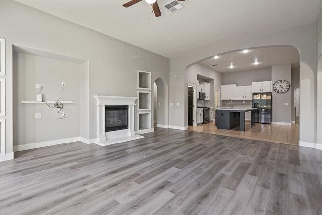 Empty room, Fireplace, Interior, Kitchen, Recessed Lighting, Wood Texture Flooring