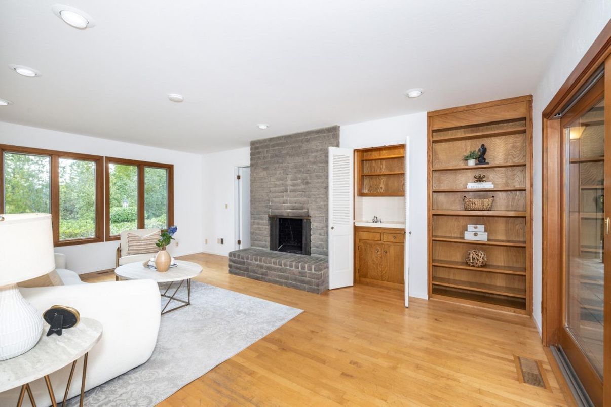 Fireplace, Interior, Living room, Recessed Lighting, Stone Walls, Wood Texture Flooring