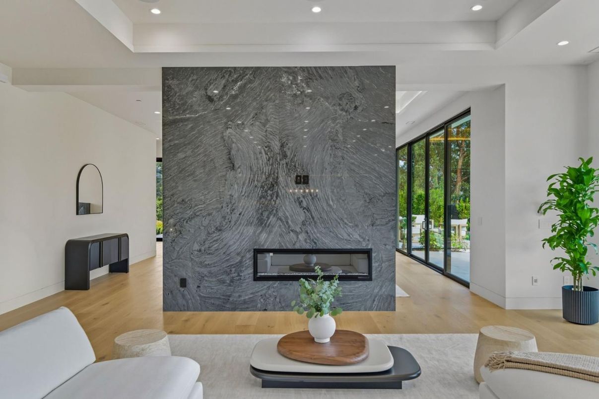 Fireplace, Interior, Living room, Marble Walls, Recessed Lighting, Wood Texture Flooring