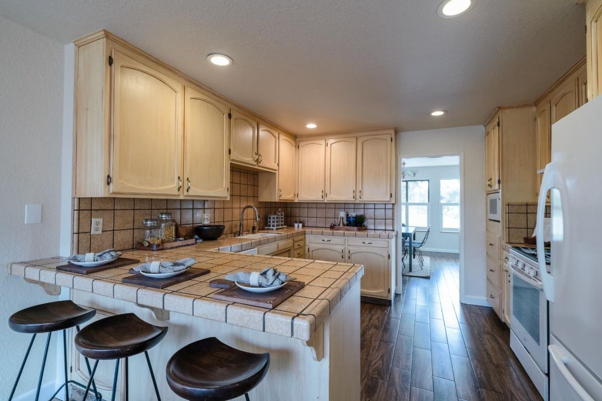 Interior, Kitchen, Recessed Lighting, Tile Countertops, Wood Texture Flooring