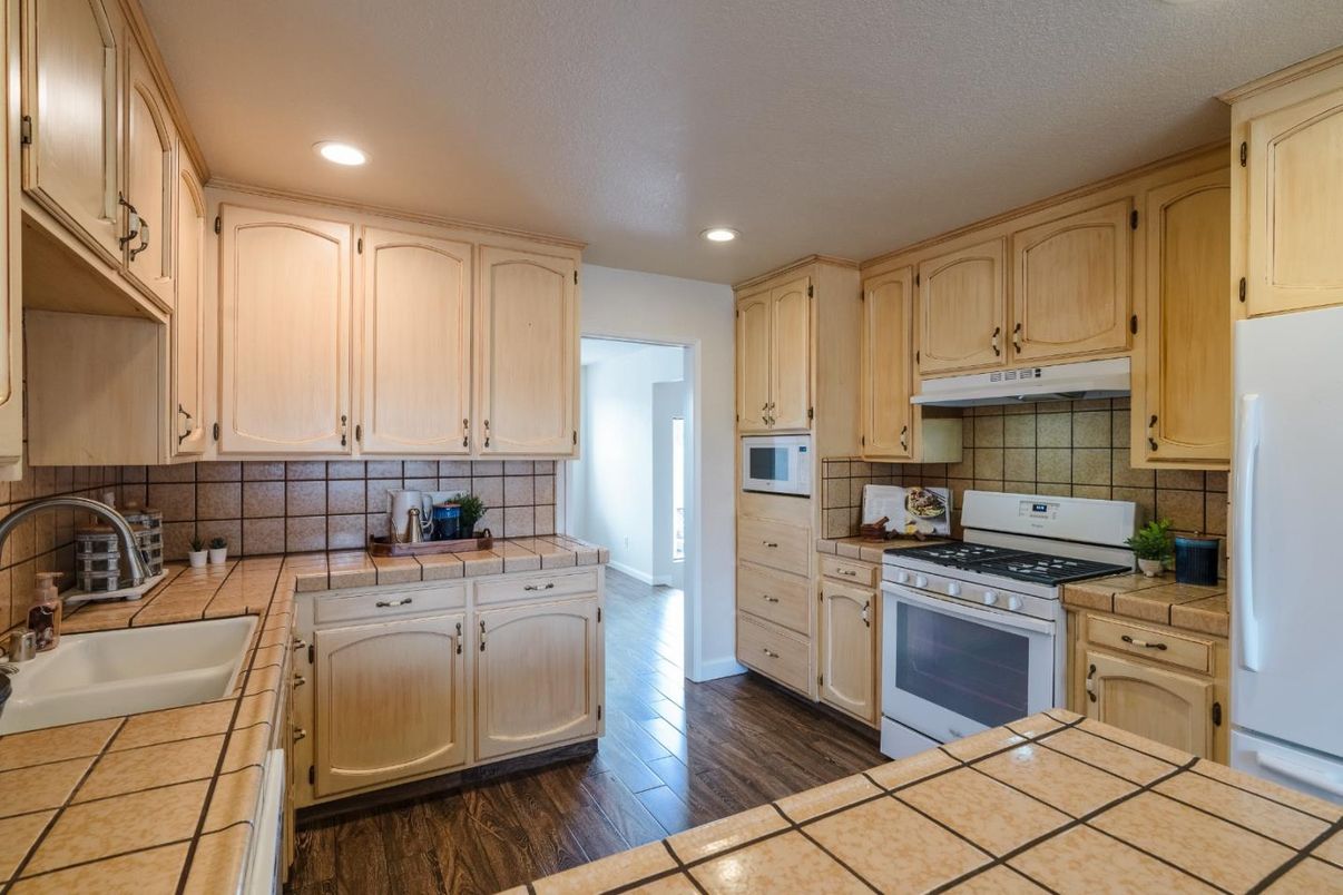 Interior, Kitchen, Recessed Lighting, Tile Countertops, Wood Texture Flooring