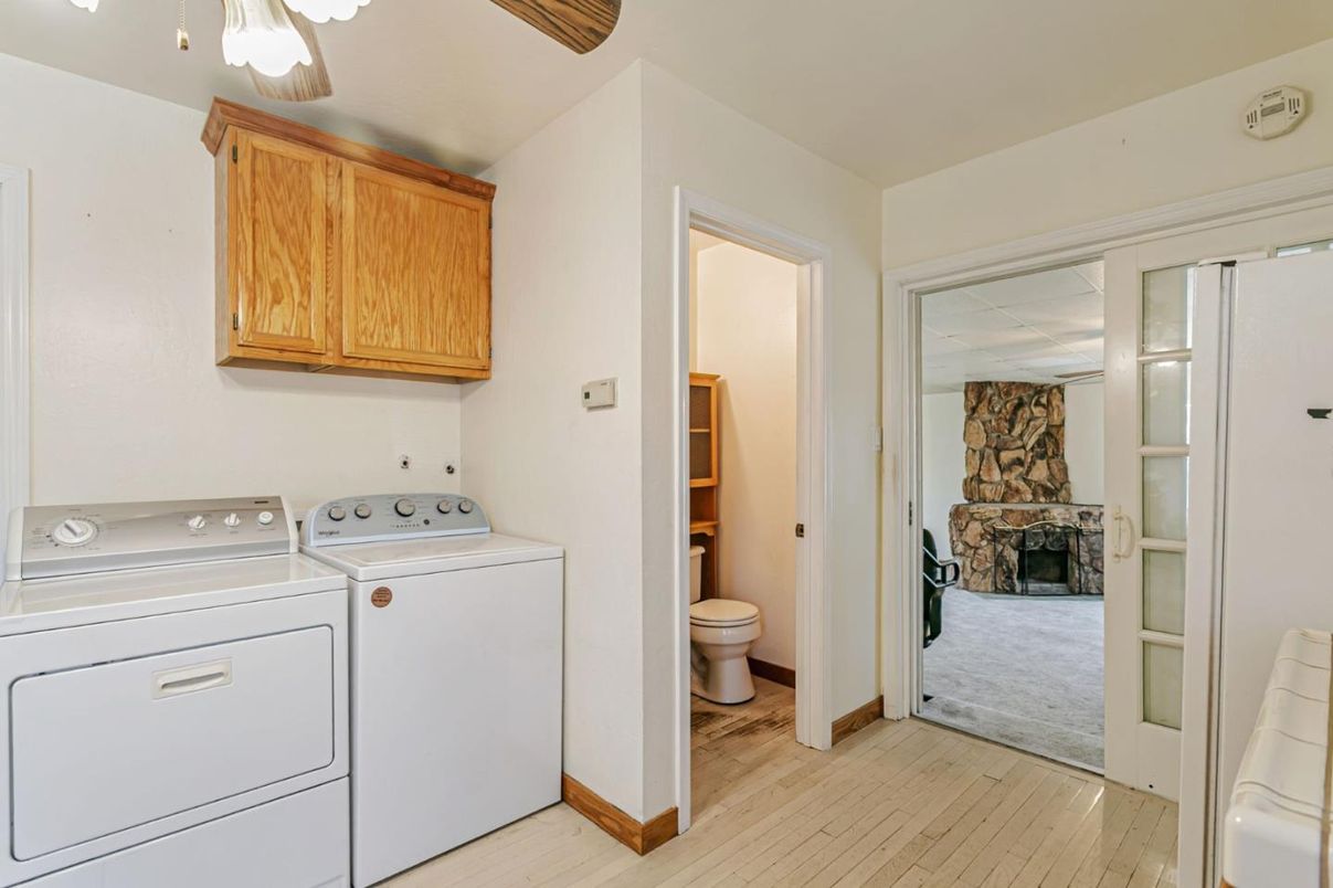 Bathroom, Fireplace, Interior, Utility Closets, Washer, Wood Texture Flooring
