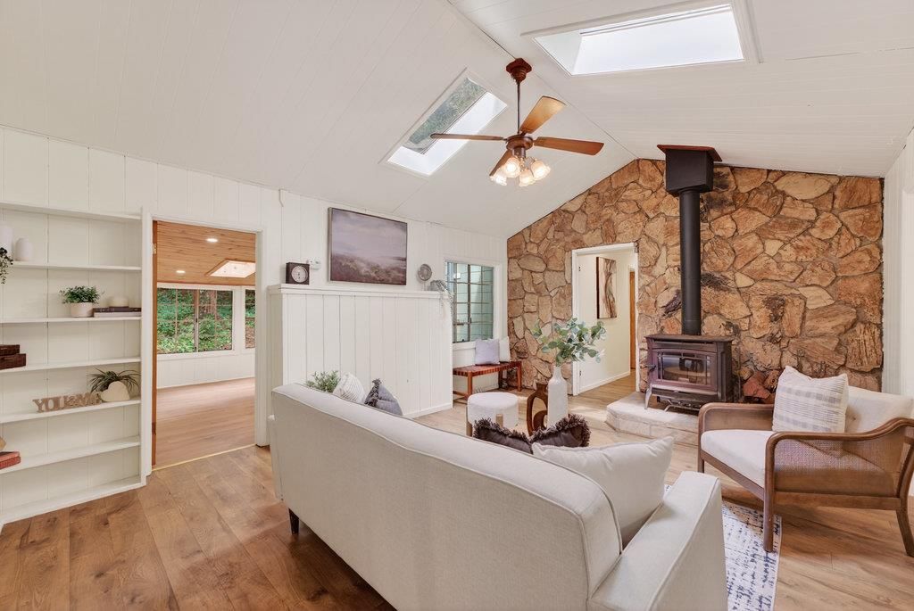 Fireplace, Interior, Living room, Recessed Lighting, Stone Walls, Wood Texture Flooring