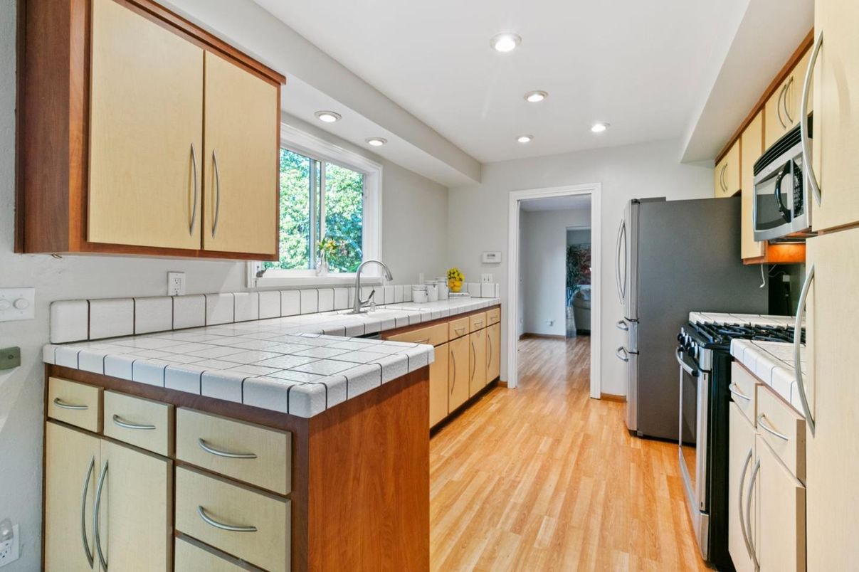 Interior, Kitchen, Recessed Lighting, Tile Countertops, Wood Texture Flooring