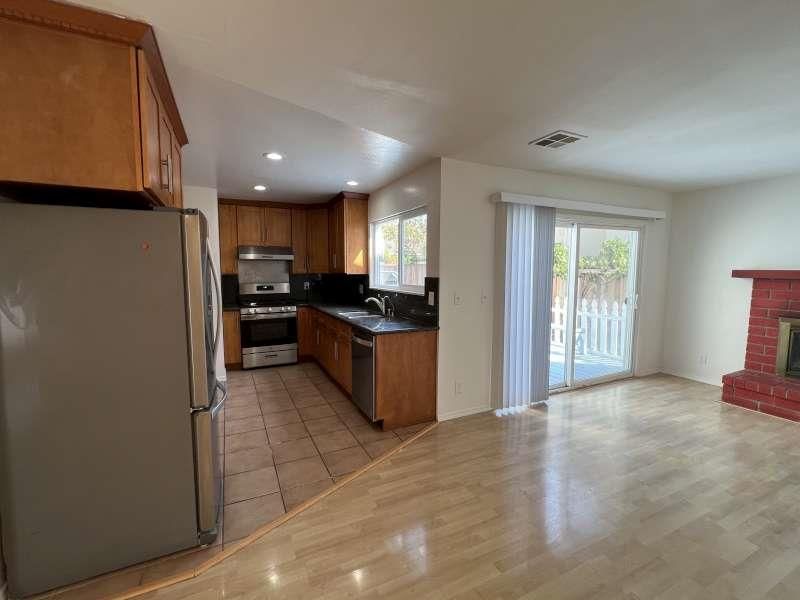Fireplace, Interior, Kitchen, Recessed Lighting, Stainless Steel Appliances, Wood Texture Flooring