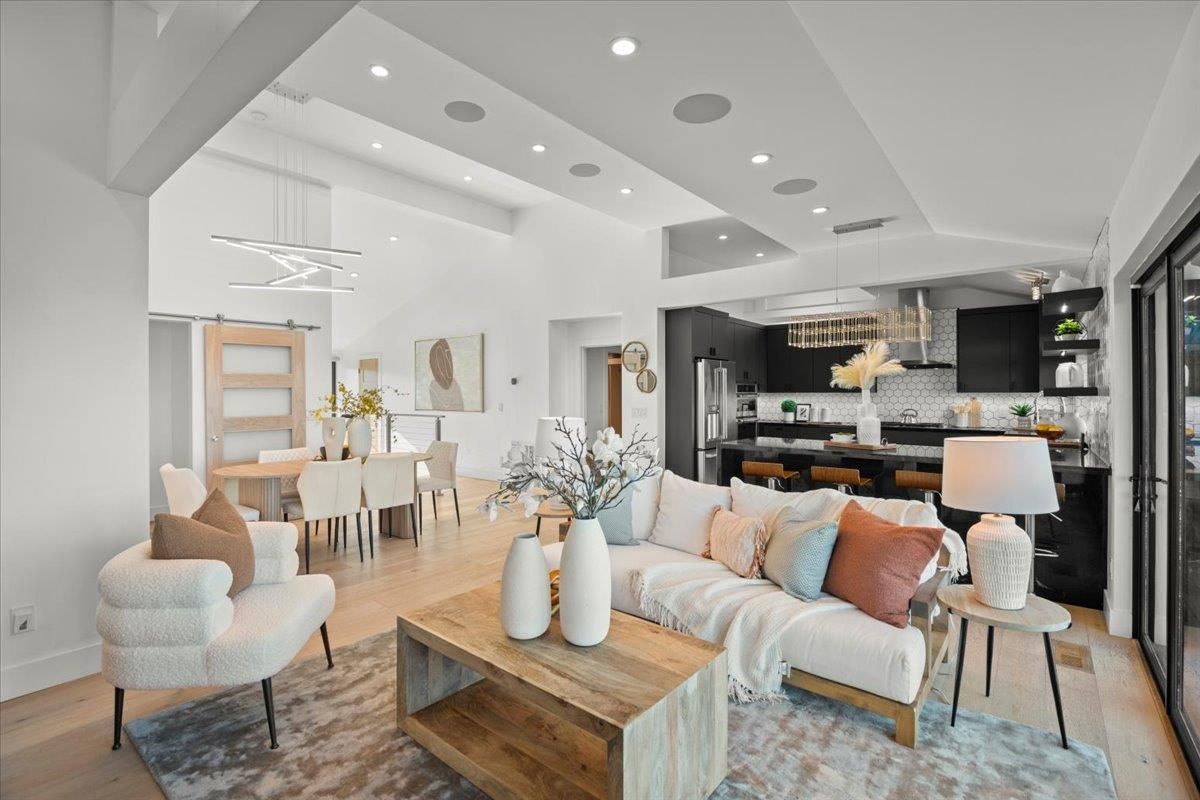 Chandelier, Dining room, Interior, Kitchen, Living room, Pendant Lights, Recessed Lighting, Stainless Steel Appliances, Wood Texture Flooring