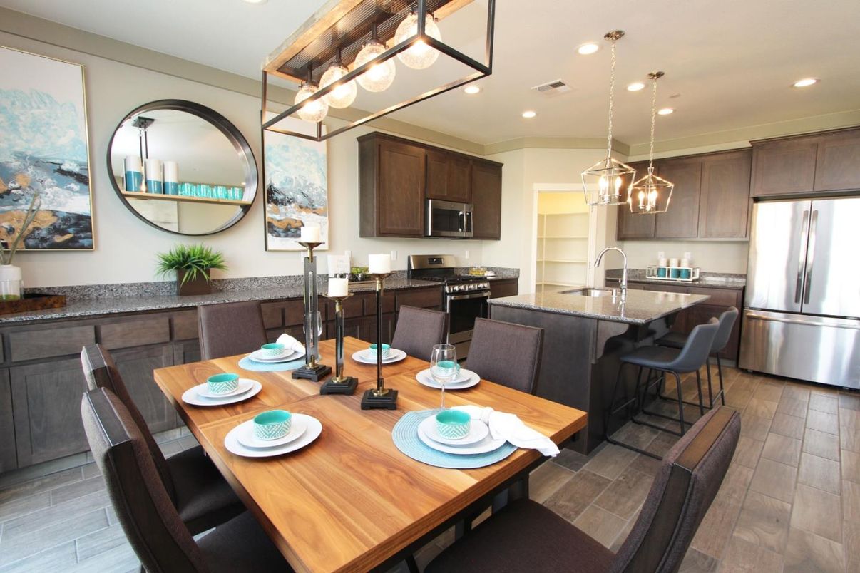 Dining room, Interior, Kitchen, Pendant Lights, Recessed Lighting, Stainless Steel Appliances, Wood Texture Flooring