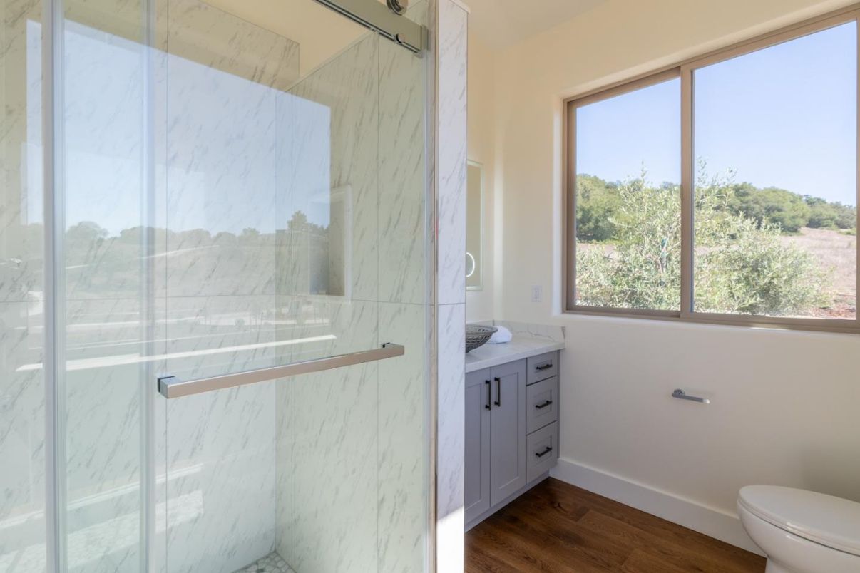 Bathroom, Glass Shower, Interior, Marble Walls, Wood Texture Flooring