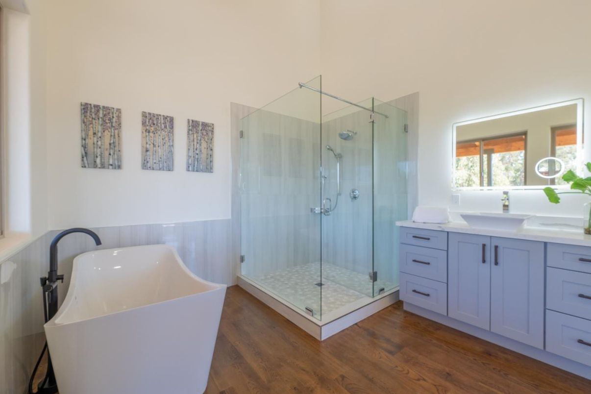 Bathroom, Dual Sink Vanities, Free Standing Baths, Glass Shower, Interior, Wood Texture Flooring