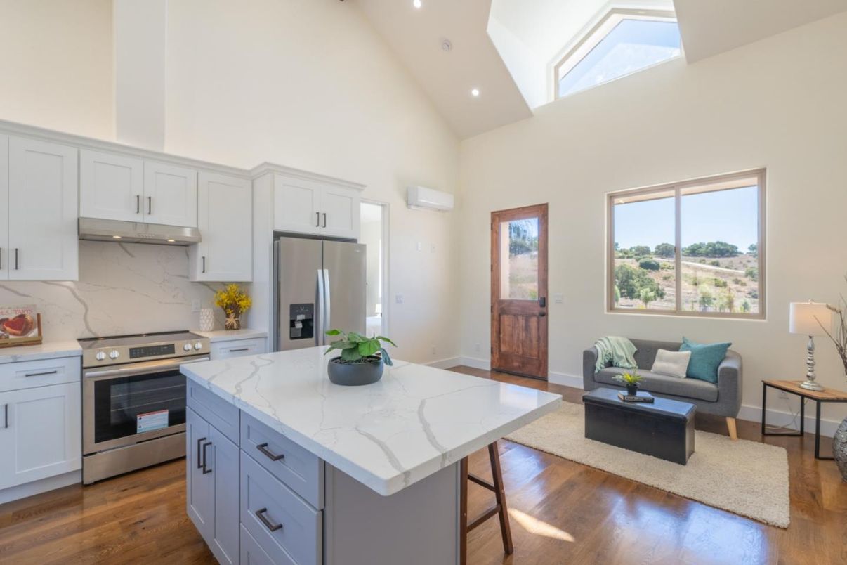 Interior, Kitchen, Marble Walls, Recessed Lighting, Stainless Steel Appliances, Wood Texture Flooring
