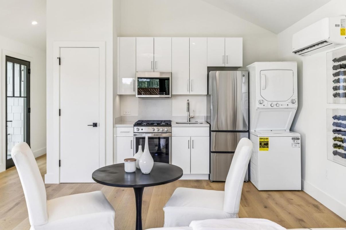 Interior, Kitchen, Recessed Lighting, Stainless Steel Appliances, Washer, Wood Texture Flooring