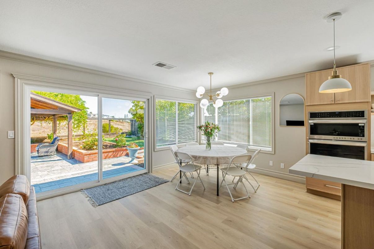 Dining room, Interior, Kitchen, Pendant Lights, Stainless Steel Appliances, Wood Texture Flooring