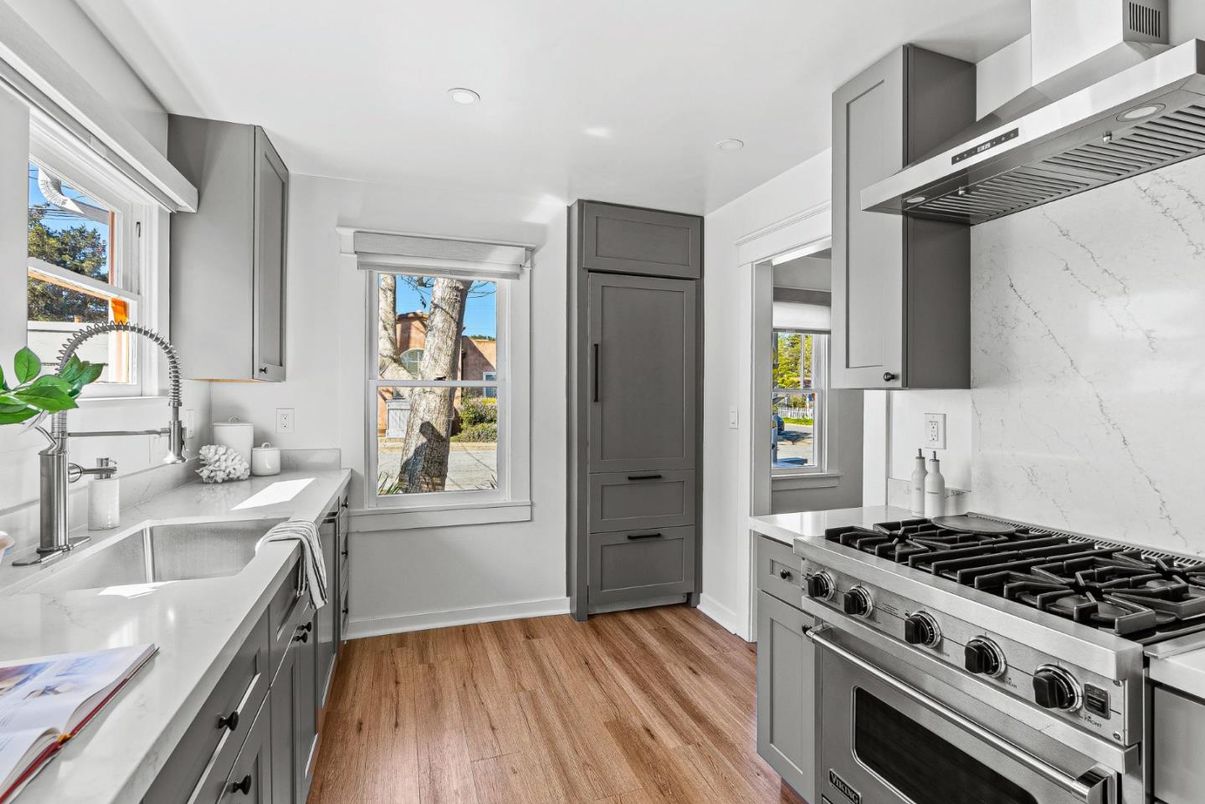 Interior, Kitchen, Marble Walls, Recessed Lighting, Stainless Steel Appliances, Wood Texture Flooring