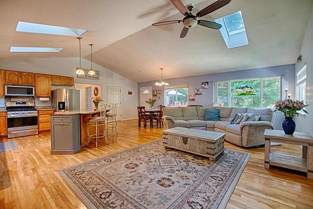 Chandelier, Dining room, Interior, Kitchen, Living room, Pendant Lights, Stainless Steel Appliances, Wood Texture Flooring