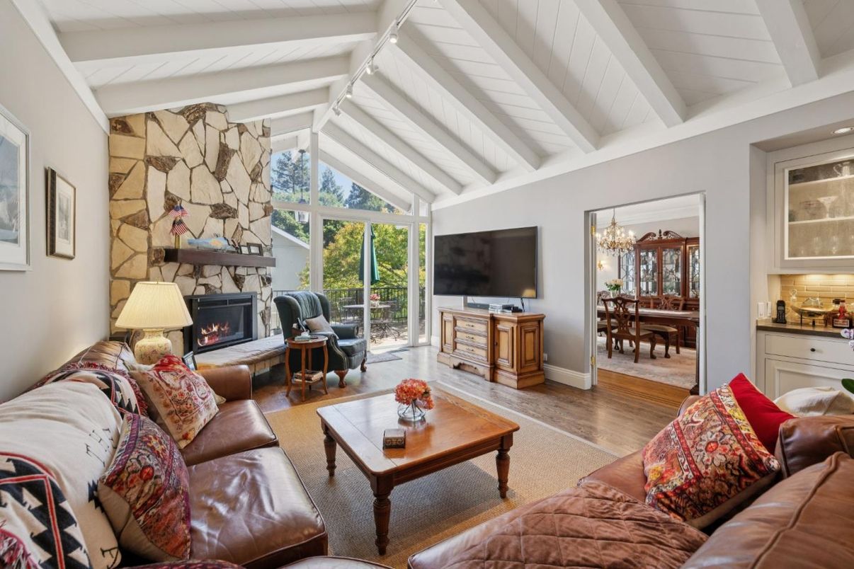 Chandelier, Dining room, Fireplace, Interior, Living room, Stone Walls, Wood Texture Flooring