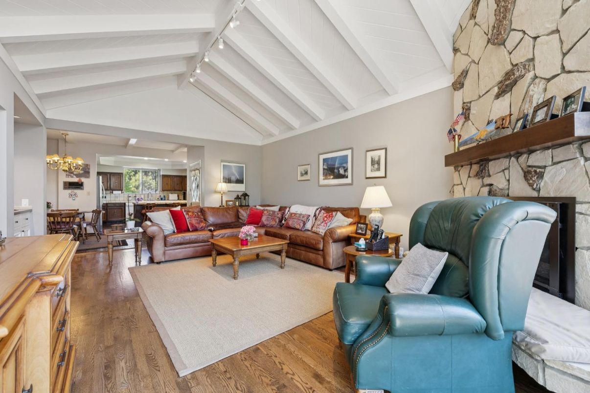 Chandelier, Dining room, Fireplace, Interior, Living room, Stone Walls, Wood Texture Flooring