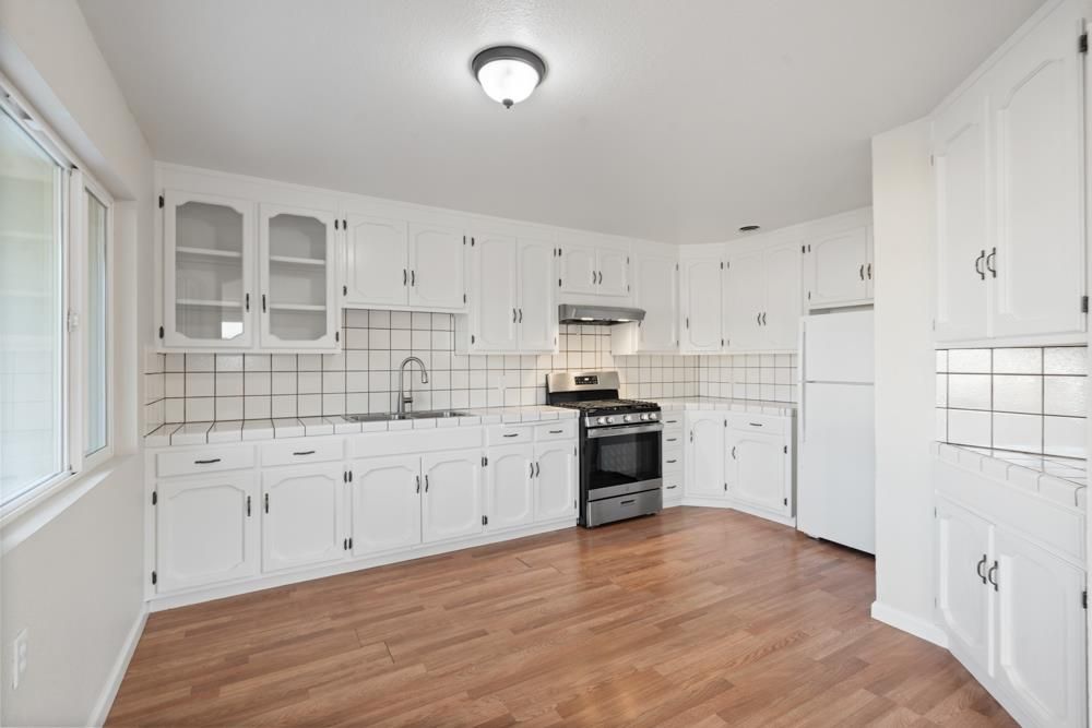 Interior, Kitchen, Tile Countertops, Wood Texture Flooring