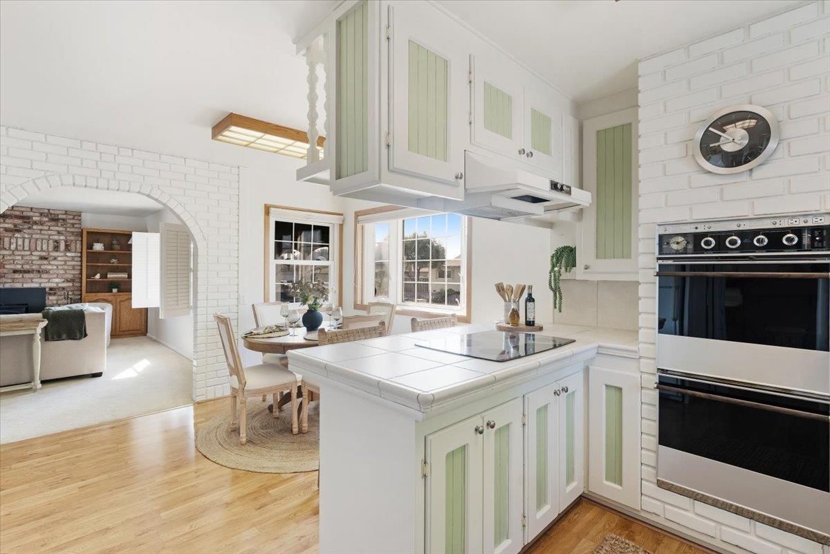 Dining room, Interior, Kitchen, Stainless Steel Appliances, Stone Walls, Tile Countertops, Wood Texture Flooring