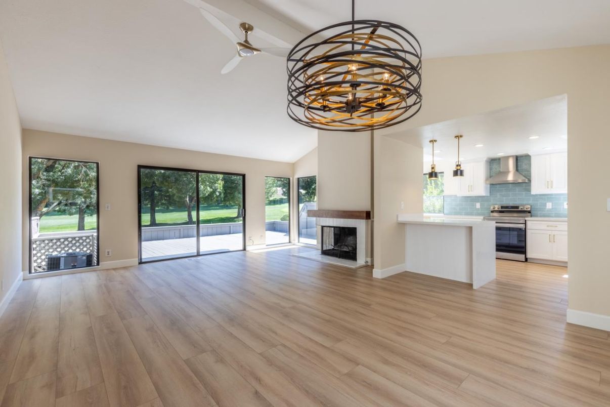 Chandelier, Empty room, Fireplace, Interior, Kitchen, Pendant Lights, Wood Texture Flooring