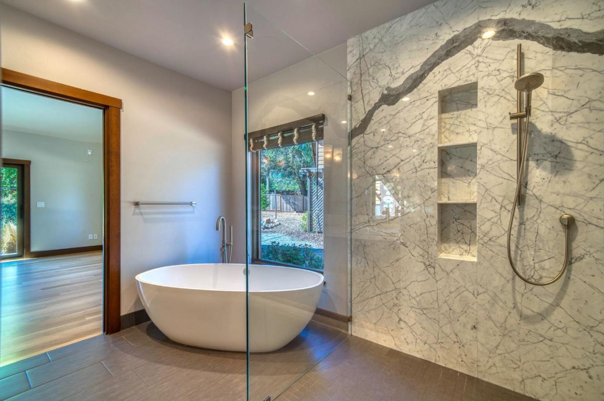 Bathroom, Free Standing Baths, Glass Shower, Interior, Marble Walls, Recessed Lighting, Wood Texture Flooring
