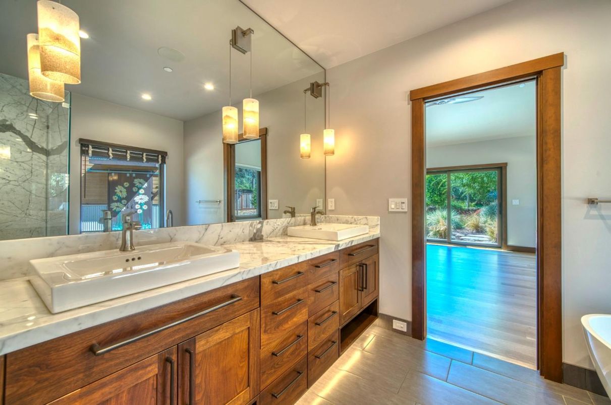 Bathroom, Dual Sink Vanities, Glass Shower, Interior, Pendant Lights, Recessed Lighting, Wood Texture Flooring