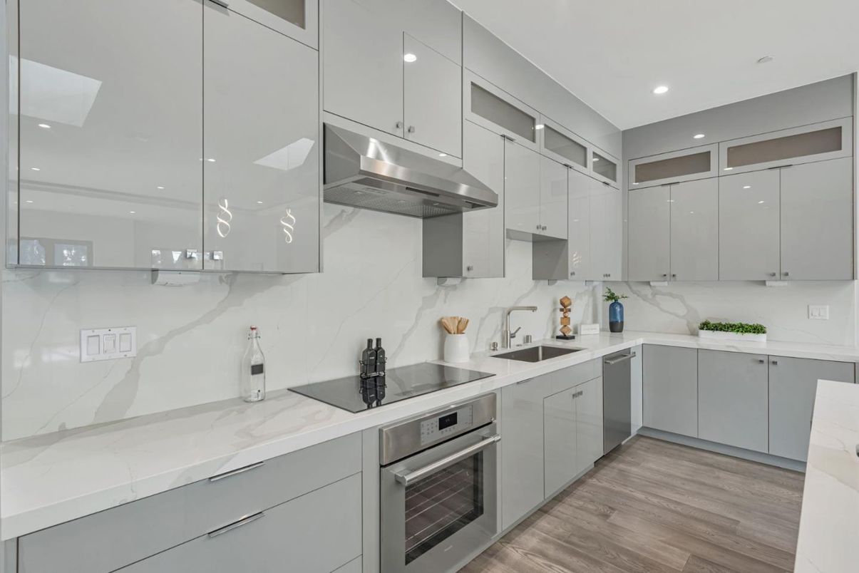 Interior, Kitchen, Marble Walls, Recessed Lighting, Stainless Steel Appliances, Wood Texture Flooring