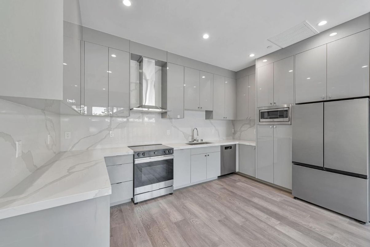 Interior, Kitchen, Marble Walls, Recessed Lighting, Stainless Steel Appliances, Wood Texture Flooring