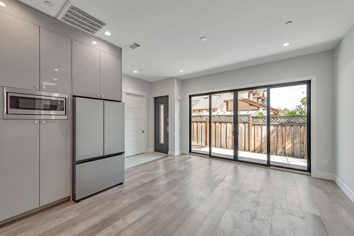 Empty room, Interior, Recessed Lighting, Stainless Steel Appliances, Wood Texture Flooring