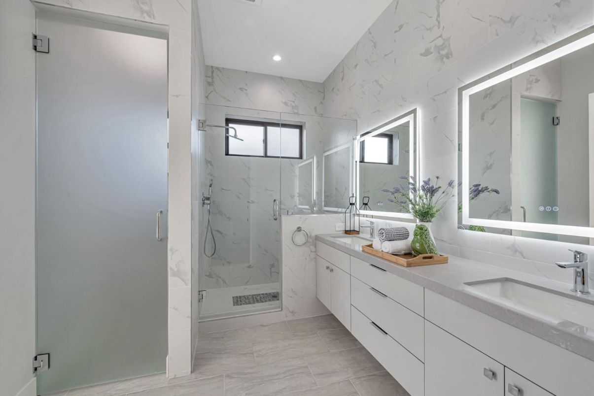 Bathroom, Dual Sink Vanities, Glass Shower, Interior, Marble, Marble Walls, Recessed Lighting