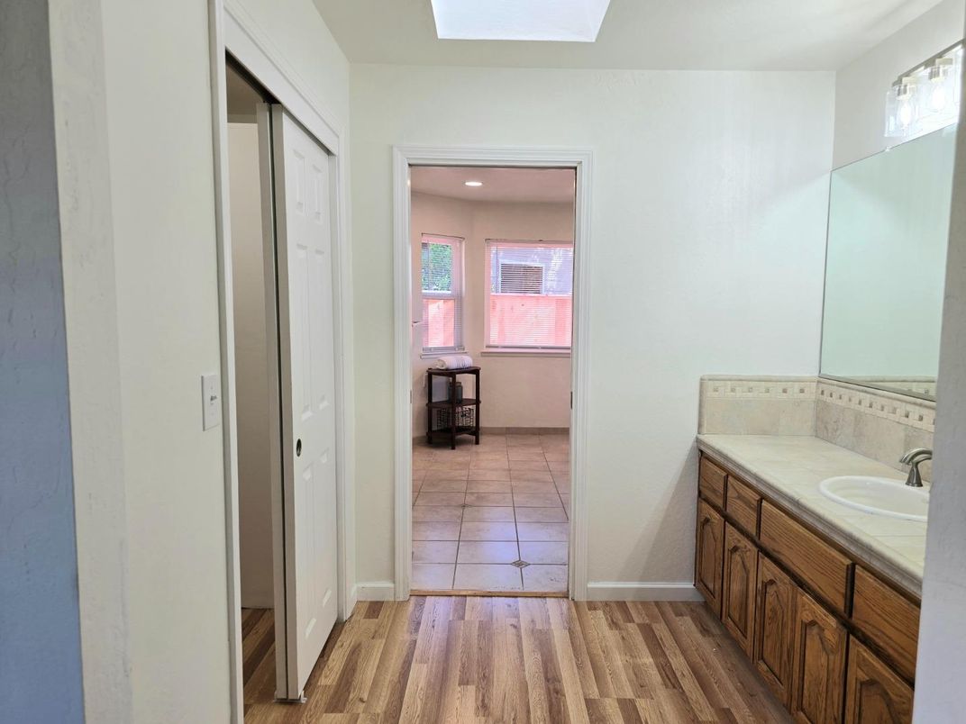 Bathroom, Dual Sink Vanities, Interior, Recessed Lighting, Tile Countertops, Wood Texture Flooring