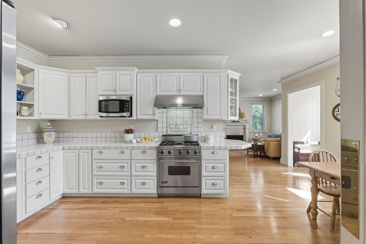 Fireplace, Interior, Kitchen, Recessed Lighting, Stainless Steel Appliances, Wood Texture Flooring