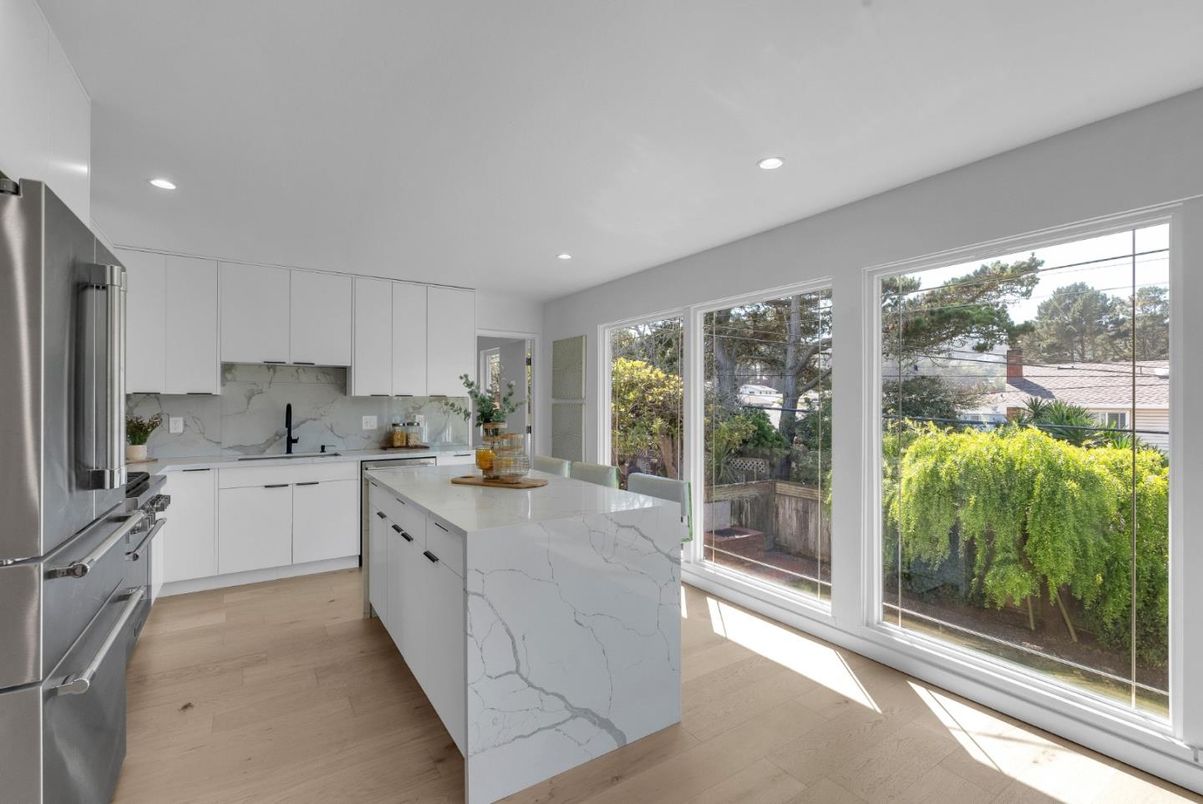 Interior, Kitchen, Marble Walls, Recessed Lighting, Stainless Steel Appliances, Wood Texture Flooring