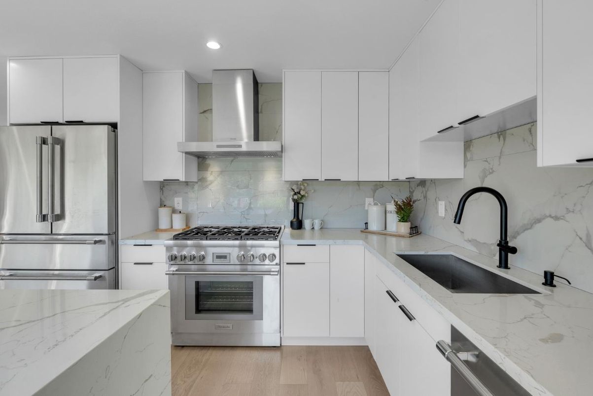Interior, Kitchen, Marble Walls, Recessed Lighting, Stainless Steel Appliances, Wood Texture Flooring