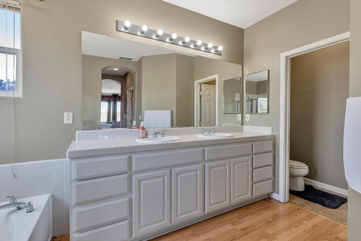 Bathroom, Dual Sink Vanities, Interior, Tile Countertops, Wood Texture Flooring