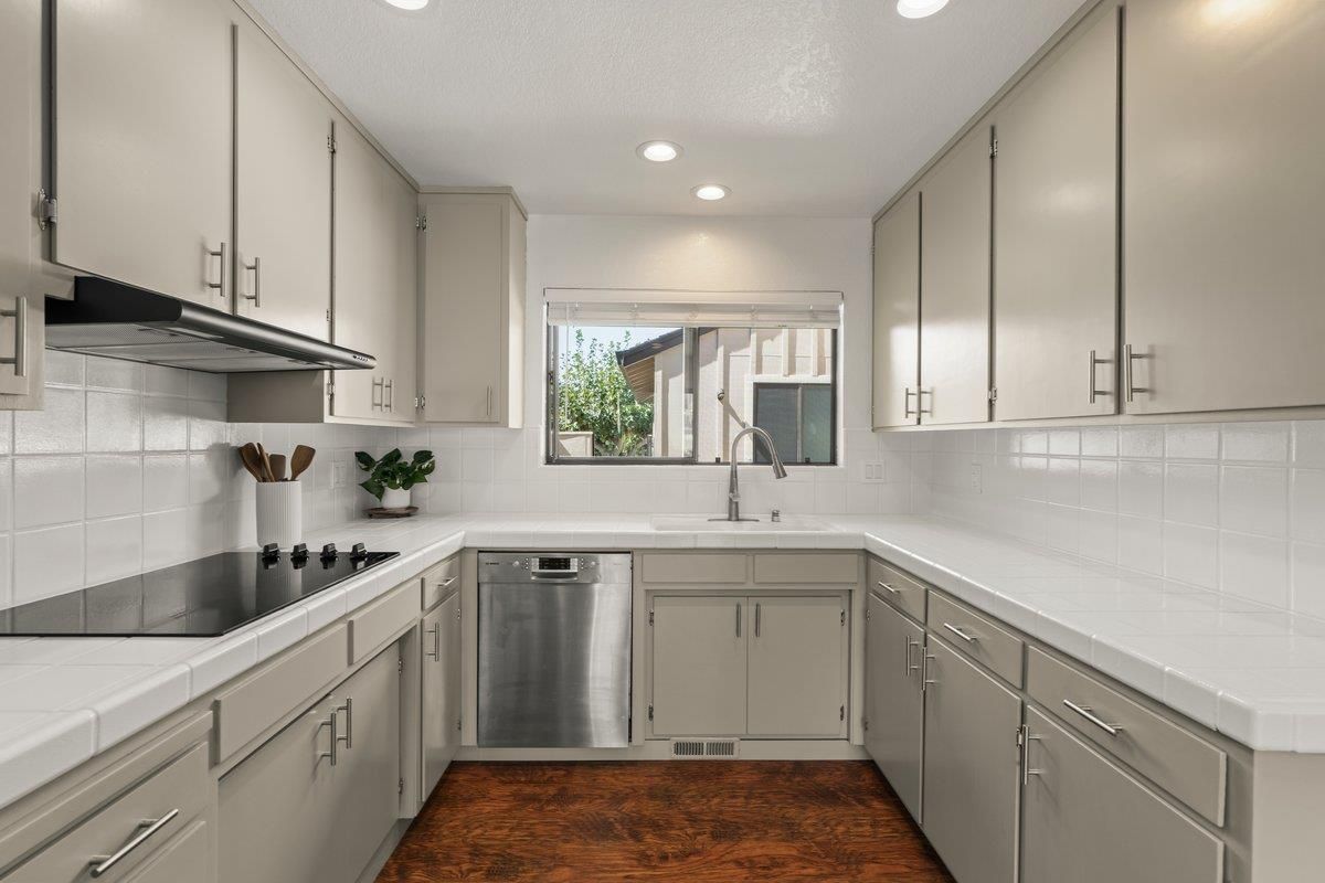 Interior, Kitchen, Recessed Lighting, Tile Countertops, Wood Texture Flooring