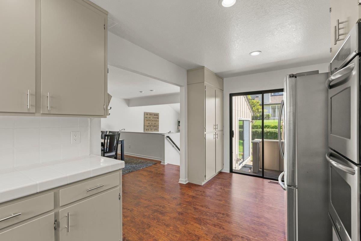 Interior, Kitchen, Recessed Lighting, Tile Countertops, Wood Texture Flooring