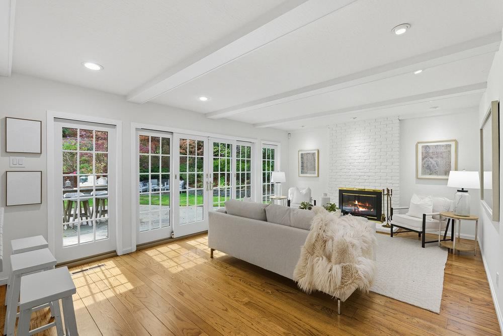 Fireplace, Interior, Living room, Recessed Lighting, Stone Walls, Wood Texture Flooring