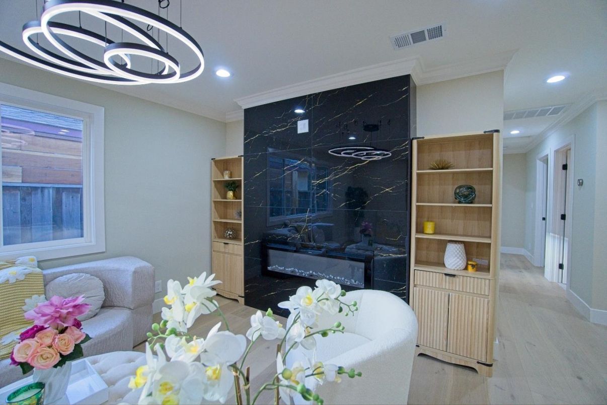 Fireplace, Interior, Marble Walls, Pendant Lights, Recessed Lighting, Wood Texture Flooring