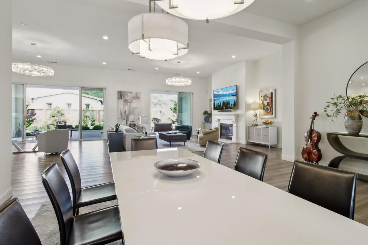 Chandelier, Dining room, Fireplace, Interior, Living room, Pendant Lights, Recessed Lighting, Wood Texture Flooring