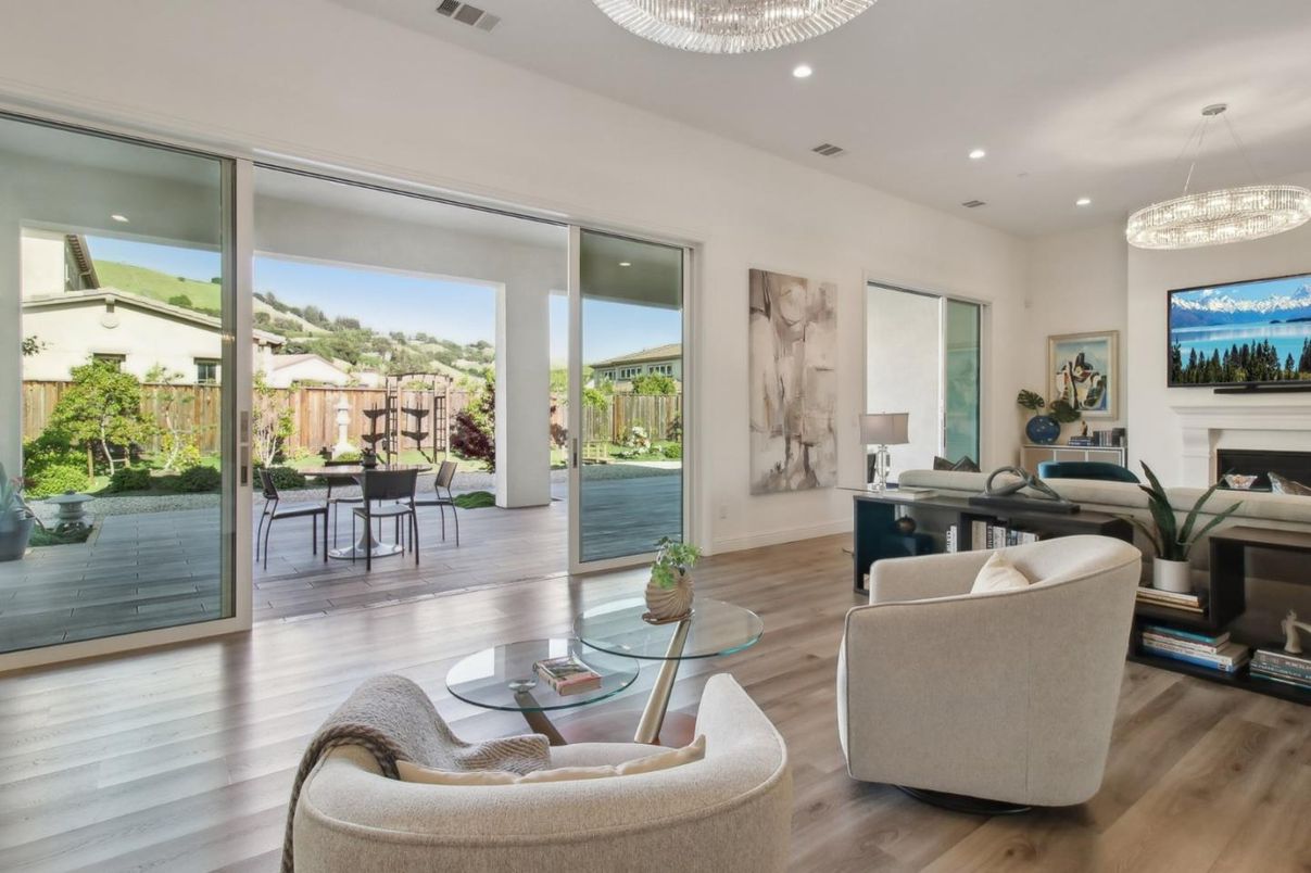 Chandelier, Dining room, Fireplace, Interior, Living room, Pendant Lights, Recessed Lighting, Wood Texture Flooring